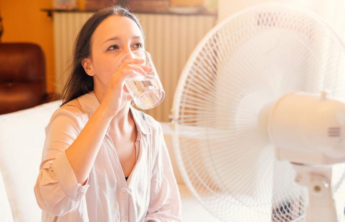 Woman feeling hot at home