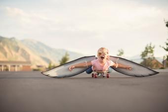 Girl with Wings On Skateboard