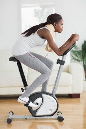 Woman working out on exercise bike