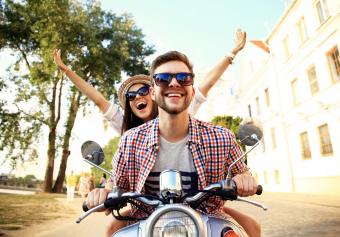 happy couple on a scooter