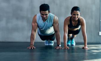 Couple doing planks or pushups