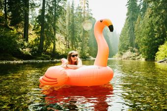 laughing woman floating down river