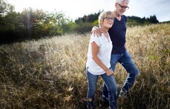 couple walking in a field