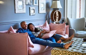 Couple at home watching television