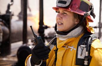 Firefighter using walkie-talkie