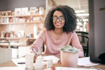 Woman doing accounting at desk