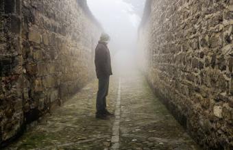 Man Standing On Footpath