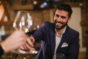 Man toasting with wine glasses