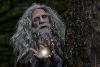 Wizard with light in hands, casting a spell