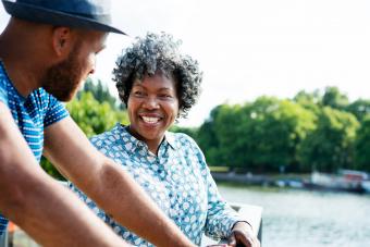 Woman and man talking by the water