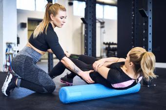 Woman with personal trainer in a gym