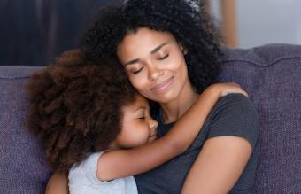 daughter embracing mother