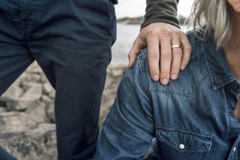 Married son putting hand on father's shoulder