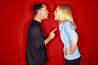 Couple arguing in a red background