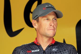Lance Armstrong signs on at the start of stage thirteen of the 2010 Tour de France - Getty Editorial Use