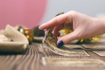 Tarot cards spread on wooden table background