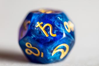 Astrology Dice with symbol of the planet Saturn