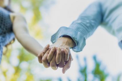 Couple holding hands