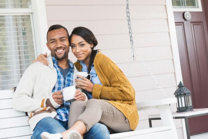 Young couple sitting on porch