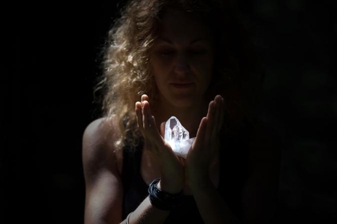 Woman holding healing crystal