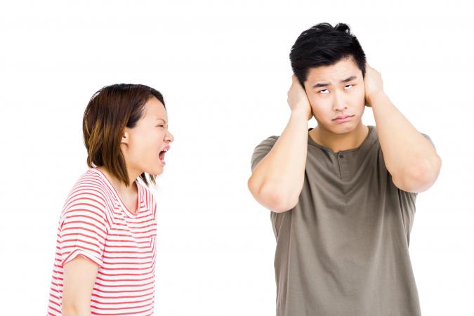 Woman yelling at frustrated man