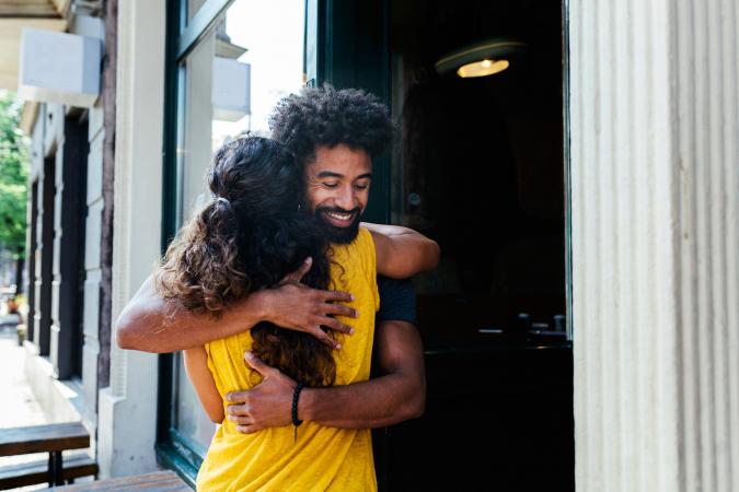 Man and woman greeting each other