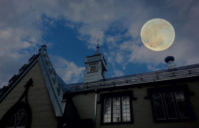 full moon over building