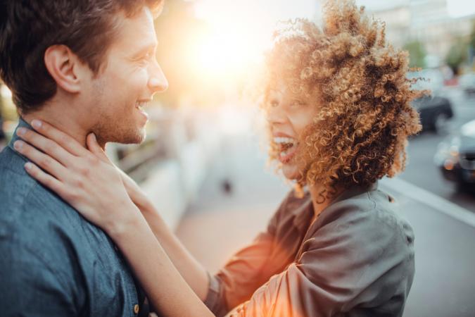 Close up of a happy young couple laughing