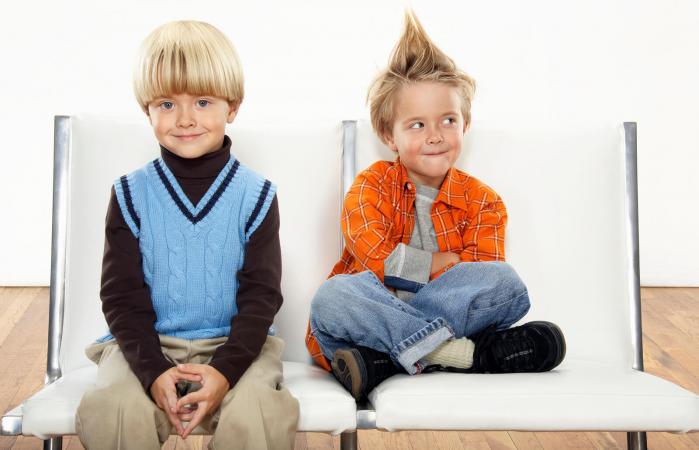 Twin boys wearing formal and casual attire