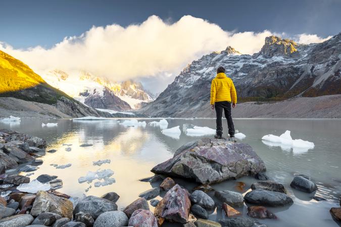 Man looking at view at sunrise in Los Glaciers national park