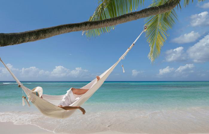 woman laying in hammock