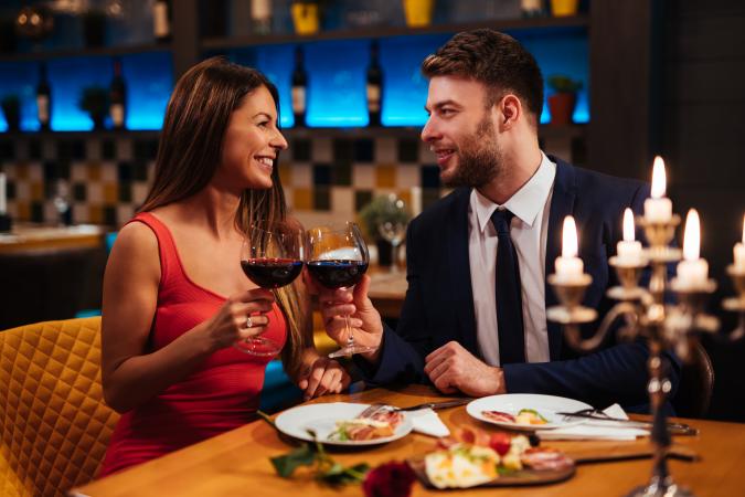 Woman and man enjoying a romantic dinner