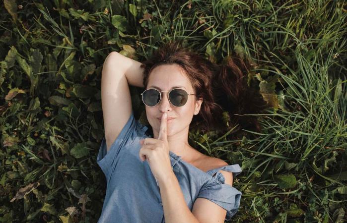 smiling woman wearing sunglasses
