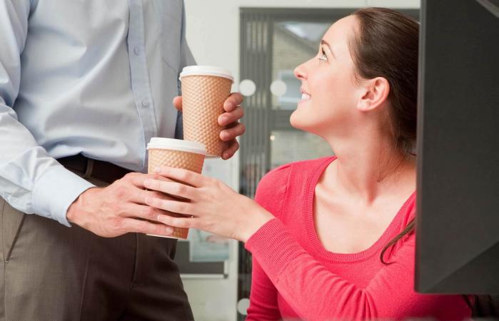 Male bringing female coffee