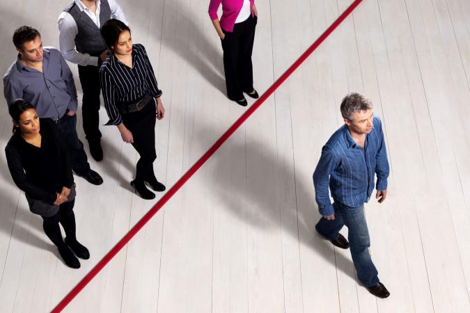 Man crossing a red line showing leadership