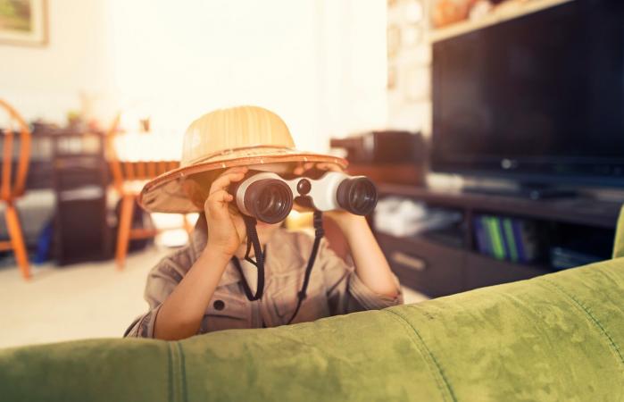 little boy exploring living room
