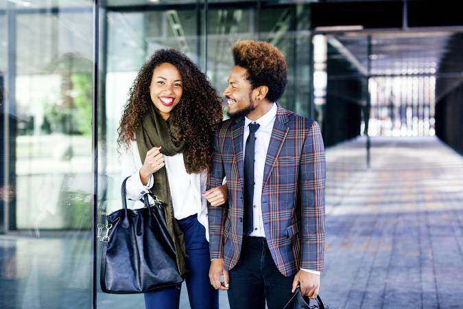 Well-dressed couple smiling