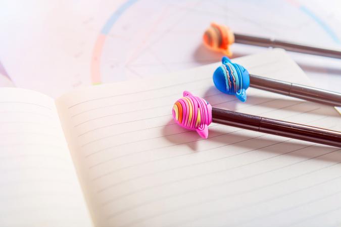 Astrological Consultation with open notebook, natal birth chart