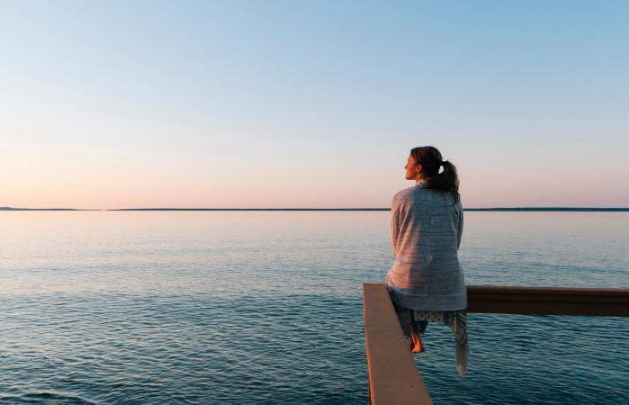 woman sitting on edge