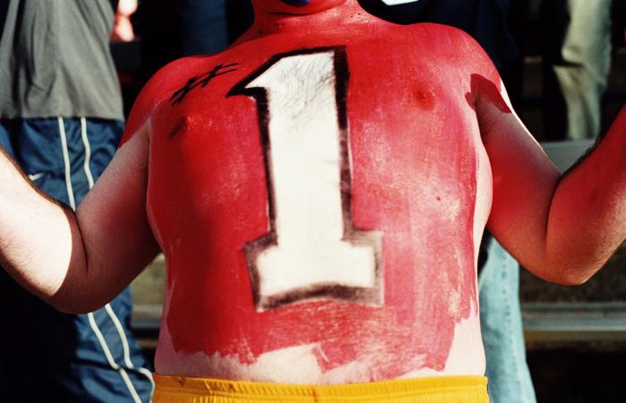 man with #1 painted on chest
