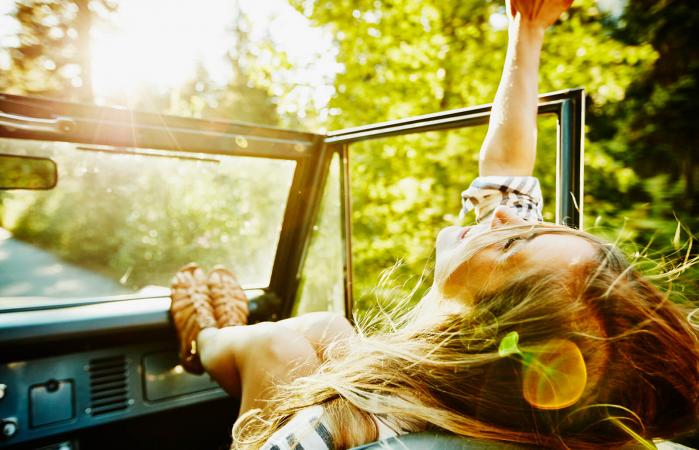 Woman riding in convertible