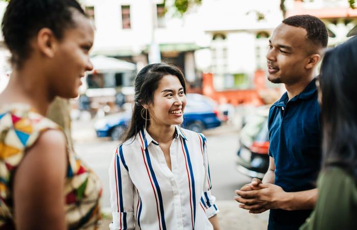 woman listening to her friends talking