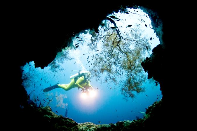 Deep sea diver in a cave