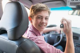 Teenage boy driving his first car