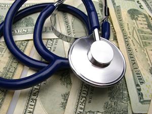 Stethoscope and dollar bills