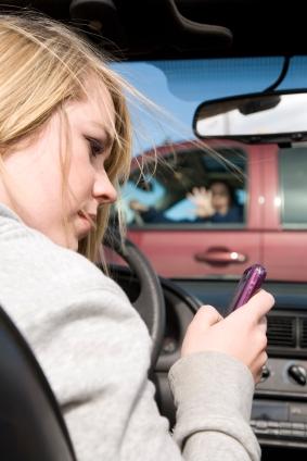 Teen driver texting and about to collide