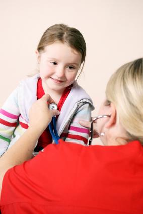 Doctor examining girl
