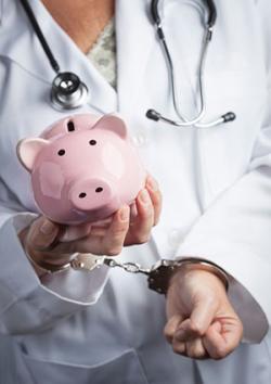 Doctor with piggy bank