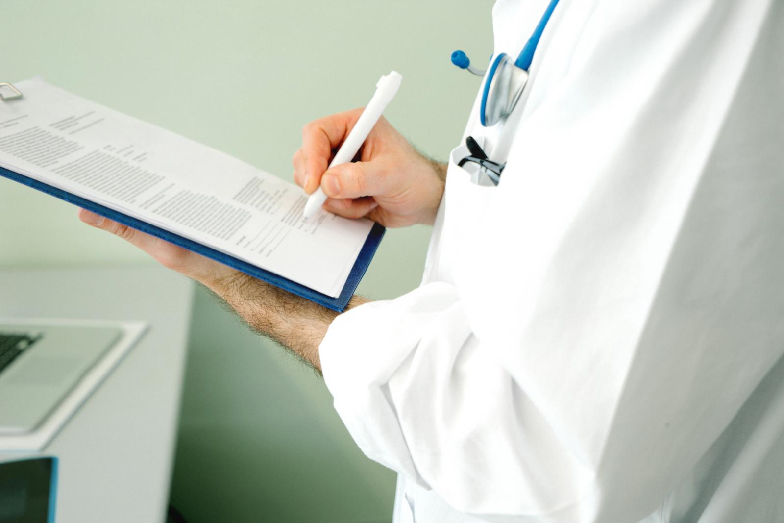 Doctor Writing Medical Report
