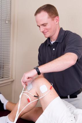 Physical therapist in session with a patient